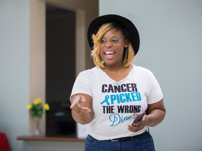 Tomeka Harps of Brandon, whose cancer was discovered at the 2017 See, Test and Treat congratulates a group of women for coming and offers encouragement. "There's no need to worry at all." Wearing a T-shirt a friend designed, she carries out its words, "Cancer Picked the Wrong Diva" with her ongoing campaign to get women to be screened. Joe Ellis/ UMMC Communications